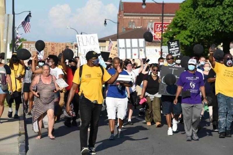 Dozens march, pray during peaceful Falls protest